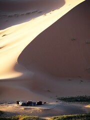 Naklejka na ściany i meble Camp at the base of the dunes
