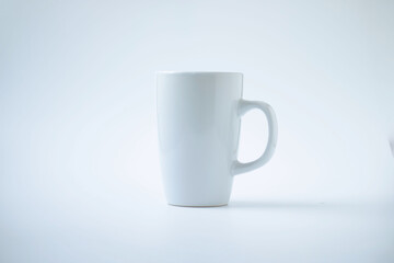 white large mug with a handle on a white horizontal background. empty wine glass for design 