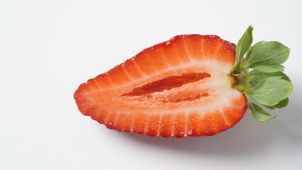 Sweet fresh strawberry half cut on white background