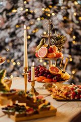 Assorted Christmas holiday desserts and sweets. Top view panoramic table scene over a rustic wood background. Bundt cake, chocolate pie, mincemeat tarts, cookies, fudge and eggnog.