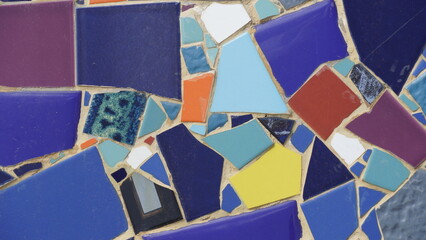 Colorful abstract ceramic mosaic. Close up. Mosaic on the wall with fragments of blue, white, black...