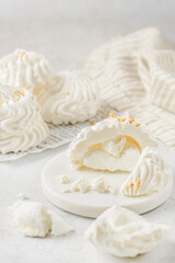 meringue on a white plate on white background