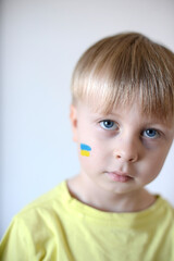 A child with the flag of Ukraine