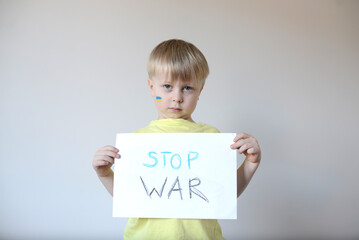 A child with the flag of Ukraine