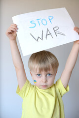 A child with the flag of Ukraine