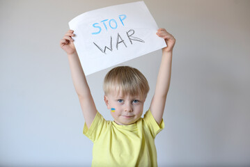 A child with the flag of Ukraine