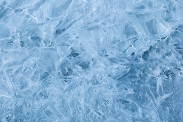 Texture of winter ice surface. Blue natural ice background.