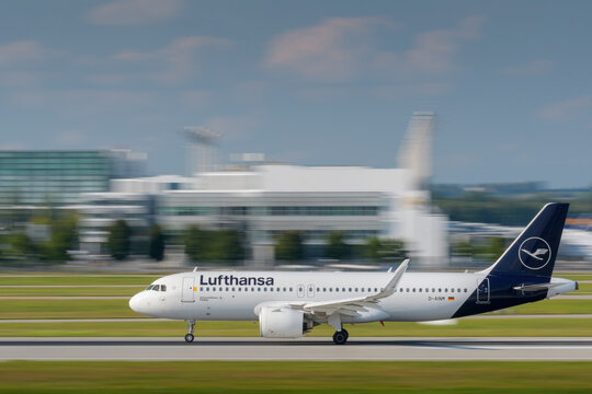 Lufthansa Airbus A320-271N with the aircraft registration D-AINM is starting on the southern runway 26L of the Munich airport MUC EDDM