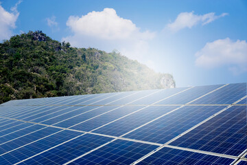 Photovoltaic or solar panel board. Blue sky background. Concept : using green and clean energy for environment. Renewable Sustainable  energy, Natural power from sunlight to reduce global warming.    