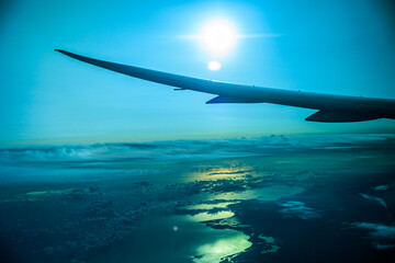 Fototapeta na wymiar 飛行機から見るオーストラリアと朝日