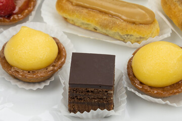 close up of sweet petit four in a white plate