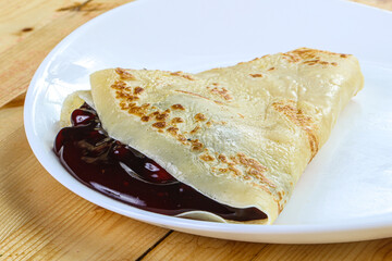 Delicous pancake with fruit jam