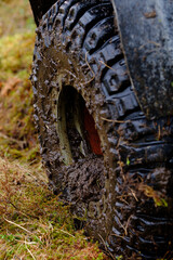 Fototapeta na wymiar muddy tire of a offroad vehicle