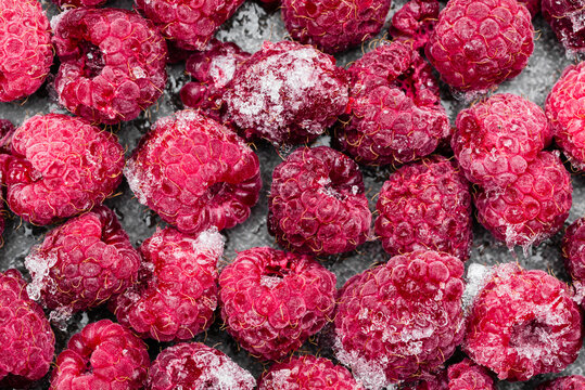 Berries. Frozen raspberries, background, top view.