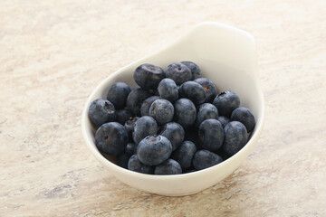 Sweet ripe blueberry heap in the bowl