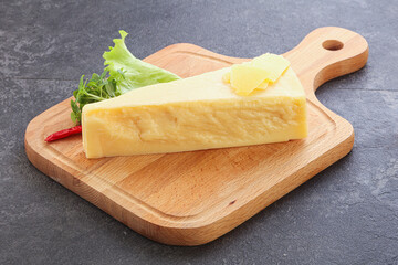 Parmesan cheese piece over board