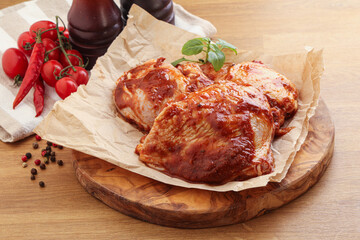 Marinated chicken leg in tomato sauce