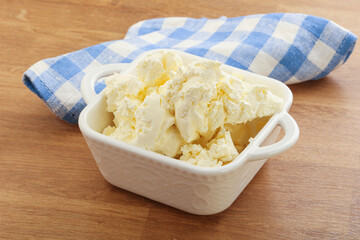 Italian soft mascarpone cheese in the bowl