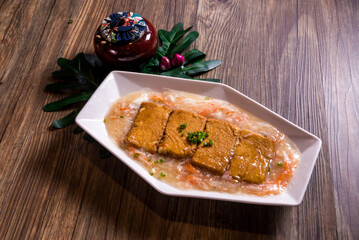 deep fried tofu beancurd with braised mushroom egg crabmeat thick sauce on wood table chinese banquet halal menu
