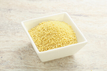 Raw couscous in the bowl