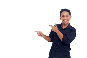 Young man gesture point finger at copy space portrait white background