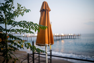 View of the sea coast with a pontoon and deck chairs, a place to relax by the sea. Private hotel...
