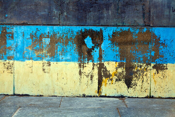 Wall element in the urban infrastructure of Kyiv, painted in the colors of the national flag of Ukraine