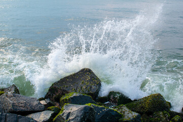waves crashing on the beach rocks