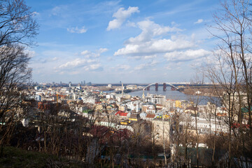 Fototapeta na wymiar Landscape with few bridges to the left bank of the Dnieper River in Kyiv city, Ukraine. Early spring