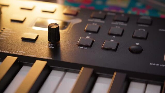 Professional music producer modern midi controller device in sound recording studio. Play and remix tracks