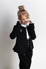 little girl posing in school uniform