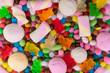 Sweets background. Lots of marshmallow candies and jelly bears.