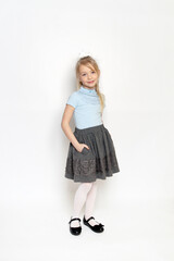 little girl posing in school uniform