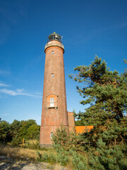 Beautiful view of the famous landmark maritime lighthouse on the Darß peninsula near the Prerow in Germany