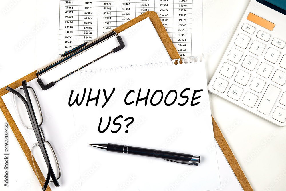 Poster text why choose us on the white paper on clipboard with chart and calculator