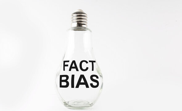 Text FACT BIAS on the bulb on the white background. Business concept