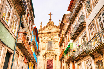 Fototapeta na wymiar Typical City of Porto Street with Sao Bento Da Vitoria Church in the Background