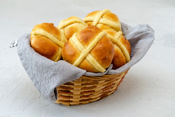 Easter buns in a wicker basket with a towel. Holy Feast