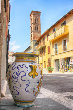 Deruta, decorated vase, bell tower and shop