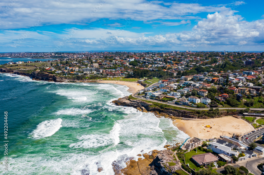 Wall mural aerial drone view of iconic bronte beach and tamarama beach coastline in sydney, australia during su