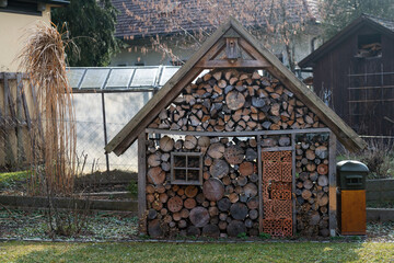 Large wooden bug house in the garden