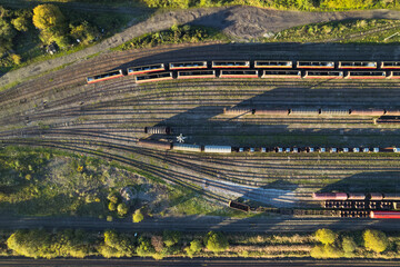 aerial shot of freight yard with train carriages
