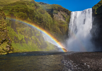 Picturesque full of water big waterfall Skogafoss autumn view, southwest Iceland.