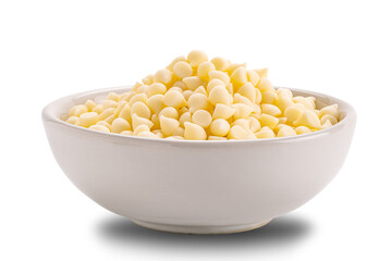 White chocolate chips in ceramic cup isolated on white background.