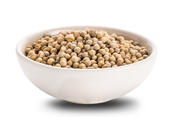 Side view closeup of white pepper in ceramic cup on white background.