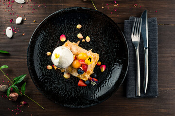 puff pastry cake with ice cream and fresh berries