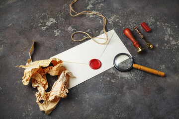 Blank vintage envelope and retro stationery on concrete background.