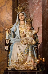 Tuinposter ROME, ITALY - AUGUST 29, 2021: The carved polychrome statue of Madonna (Our Lady of Mount Carmel) in the church Chiesa di Santa Maria della Scala by unknown artist. © Renáta Sedmáková