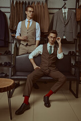 Fototapeta na wymiar respectable men in clothes shop