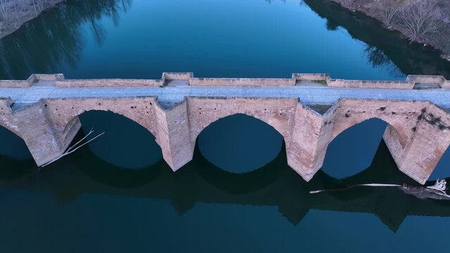 Aerial image of the Gothic-style Briñas Bridge over the Ebro River in the municipality of Haro. La Rioja, Spain, Europe